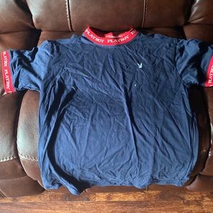 This a blue playboy shirt that’s a small. Never been worn.